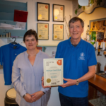 Debbie Hutchins receives the CAMRA Club of the Year award from West Berkshire CAMRA Secretary Mike Avery on 19th April 2023