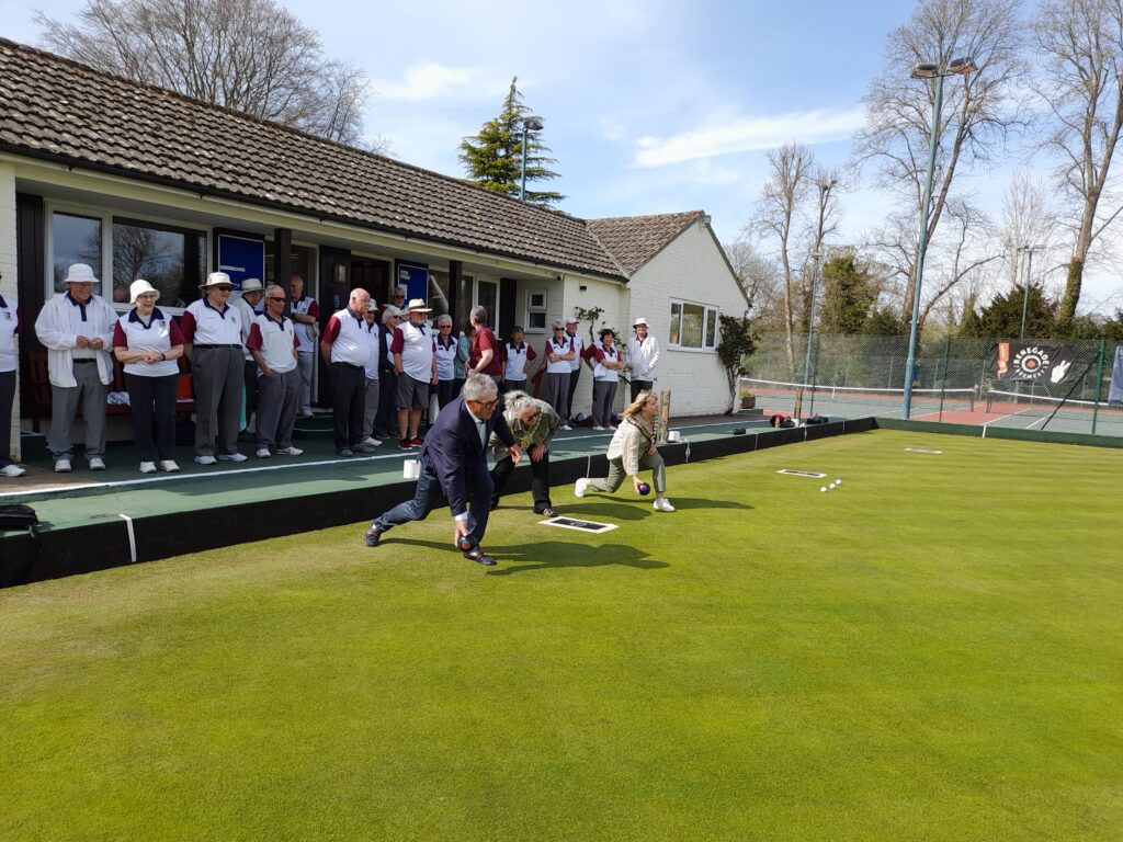 John Williams (senior partner of St James Place who is our chief sponsor) , Julie Lloyd, Town & Manor constable and Helen Simpson, Hungerford Mayor open the Hungerford Bowling Club green for the 2025 season with the first bowls.